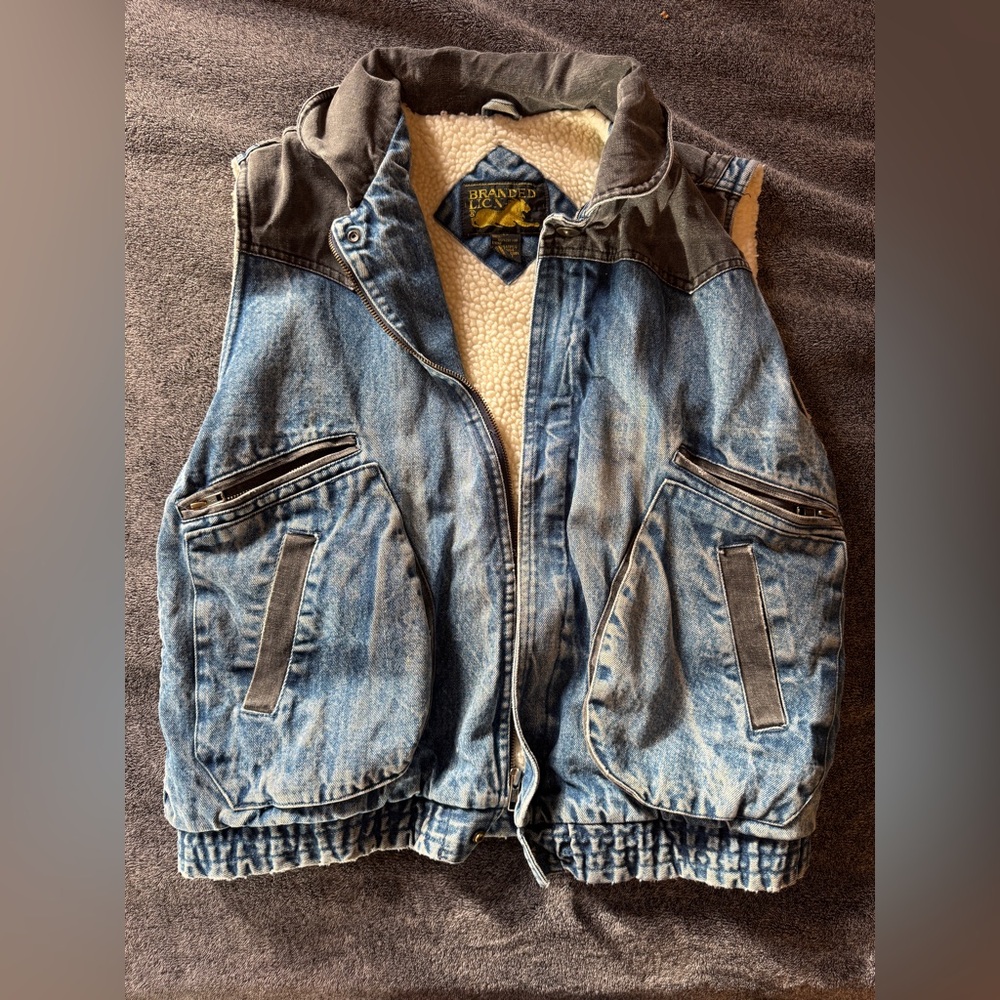 Vintage Sherpa lined acid washed denim vest.